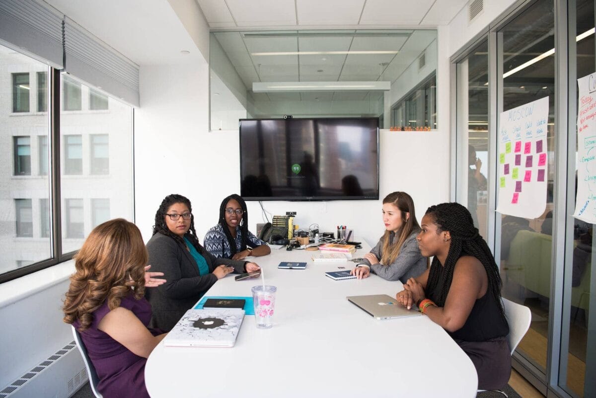 group of women gathered inside conference room
