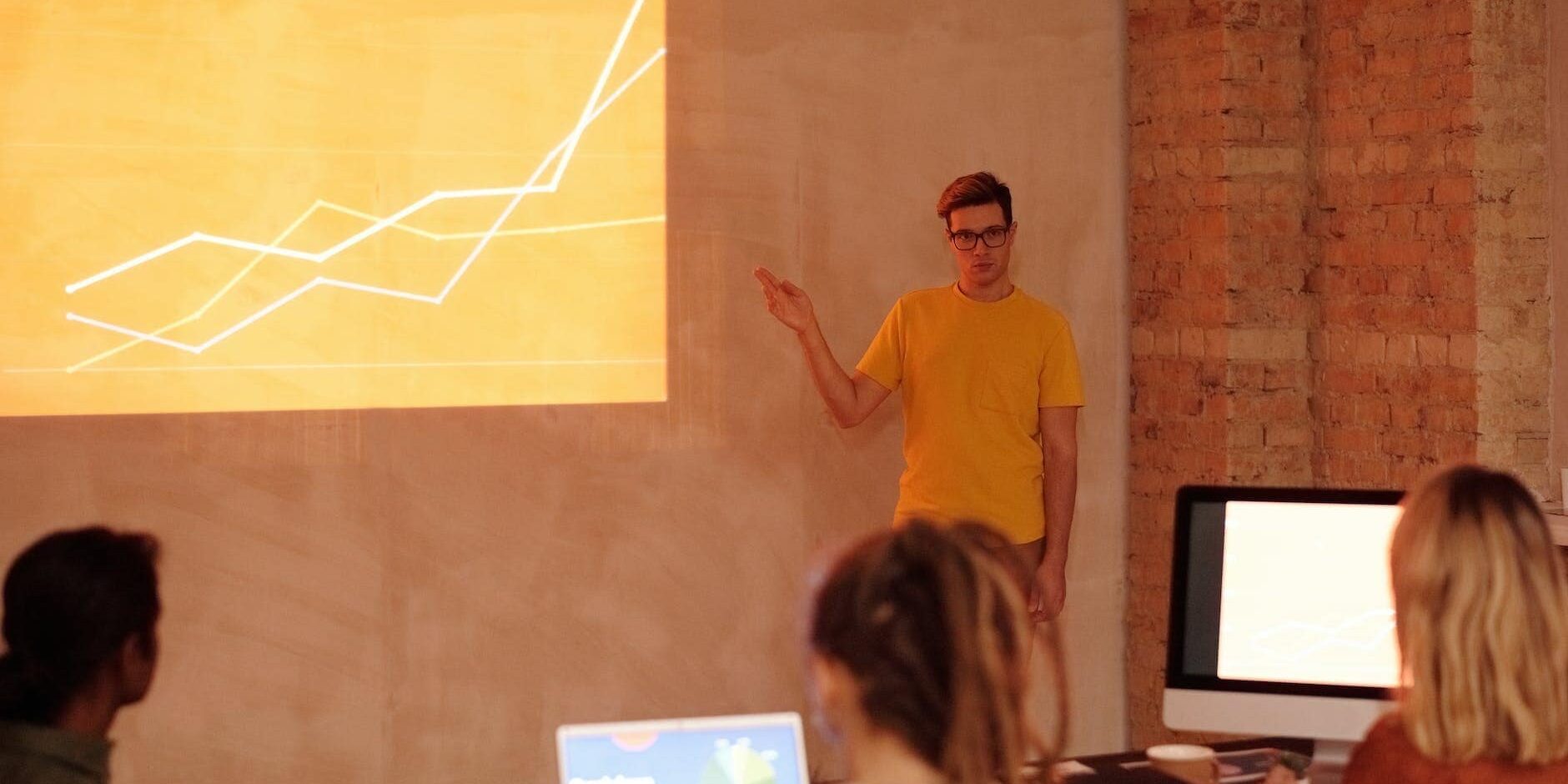 a man standing in front of the room