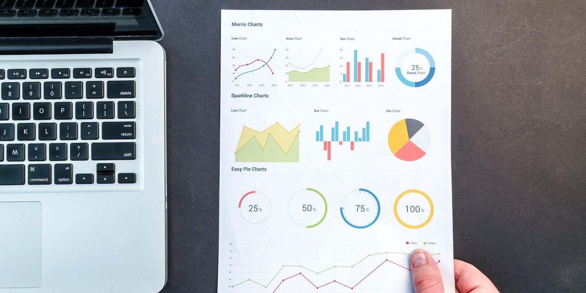 person holding chart and bar graph