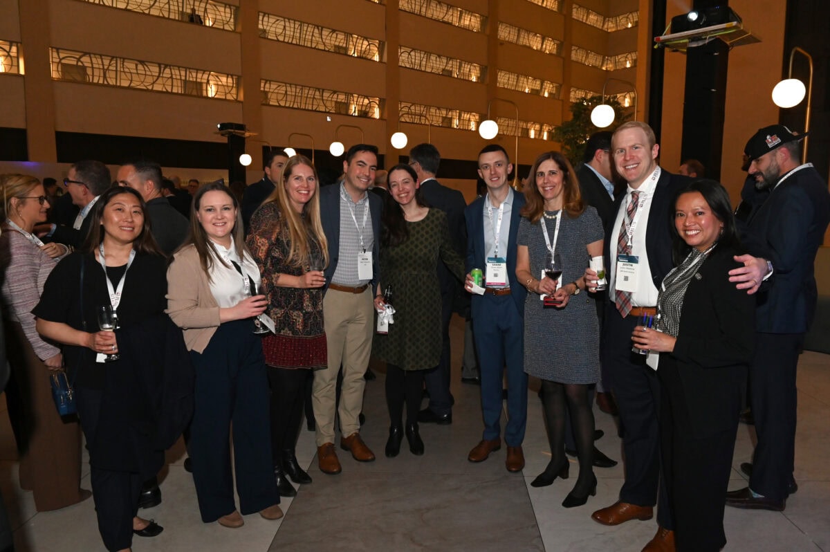 A group of 8 attendees from the PLUS Symposia Series in NYC.