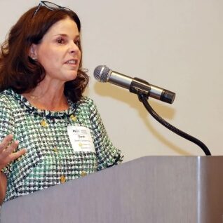 woman-speaking-podium