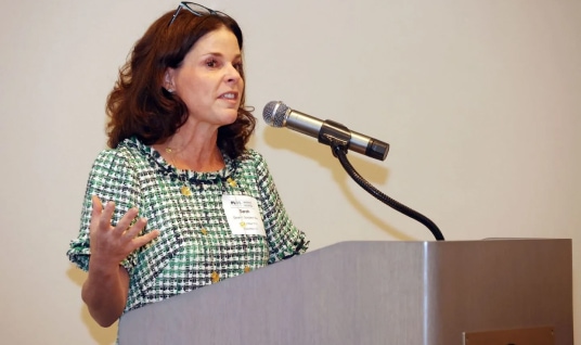woman-speaking-podium