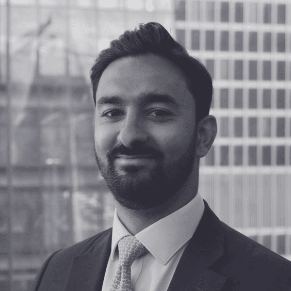 Black and white headshot of Alek Pillay.