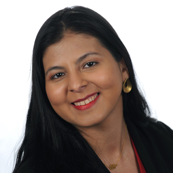 Headshot of Jessenia Vazcones-Yagual from the neck up. She has dark skin and dark hair and red lipstick.