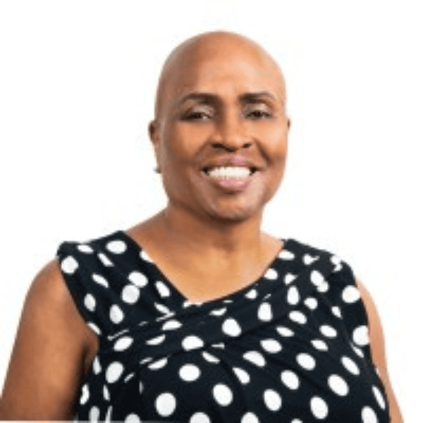 Headshot of Sherron Williams of Argo Re. Wearing a black top with polka dots from the chest up