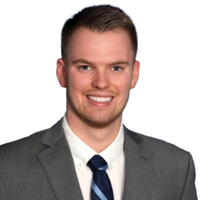 Man smiling for a headshot photo against a white background